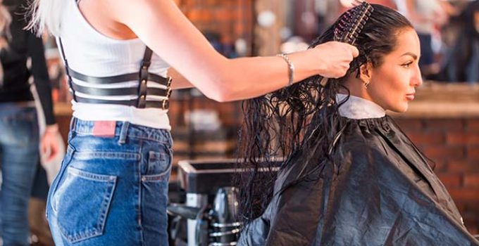 hairdresser applying keratin