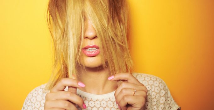 woman unhappy with her yellow hair