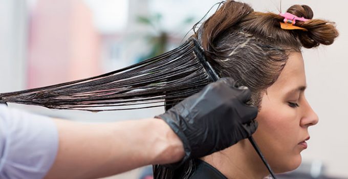 hairdresser bleaches client's black hair